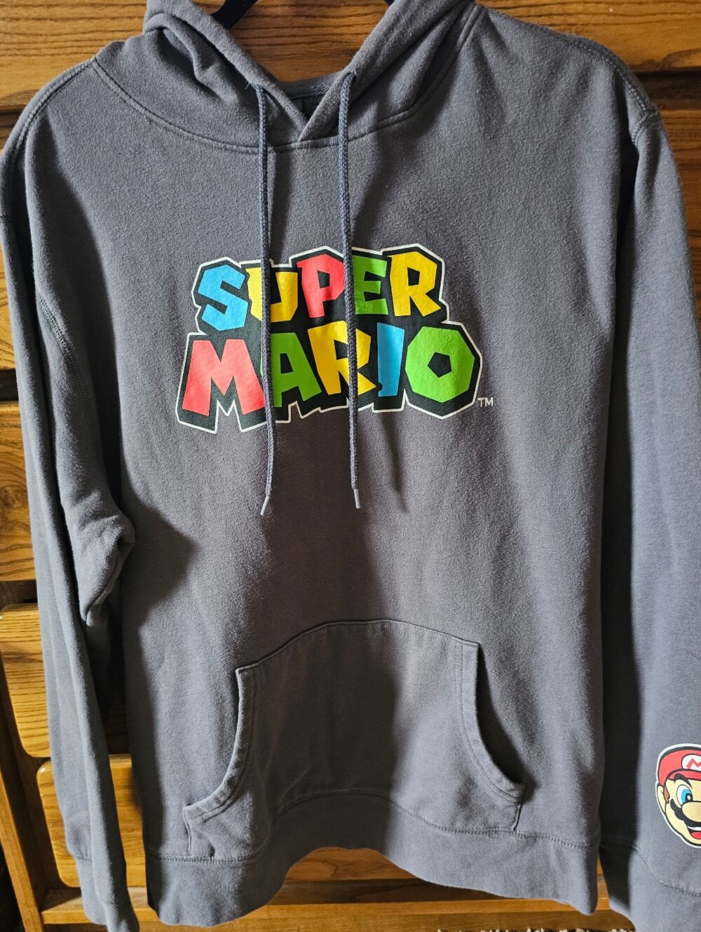 Super Mario Bros hoodie features a large graphic logo Size X-Large